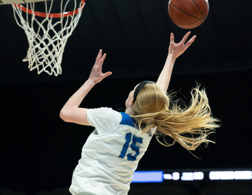 Girl playing basketball for Christian Life Schools