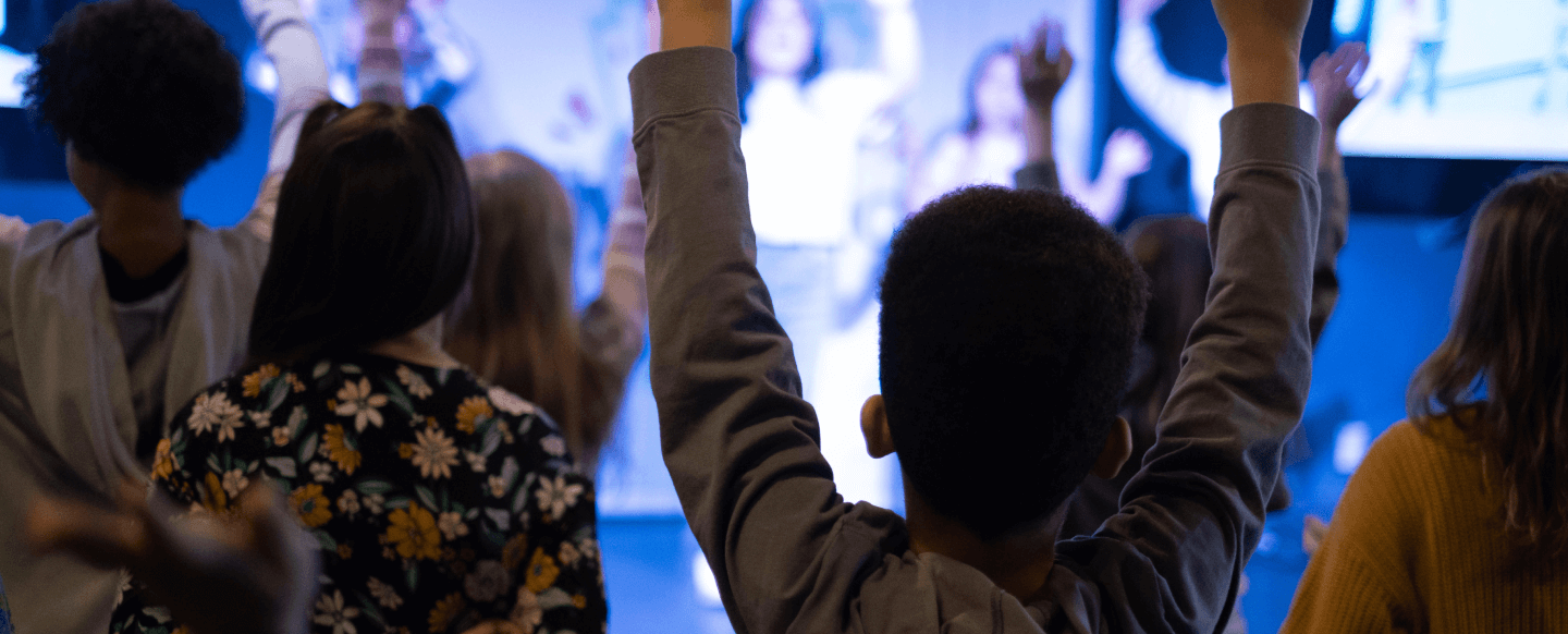 Kids Worshipping with hands raised