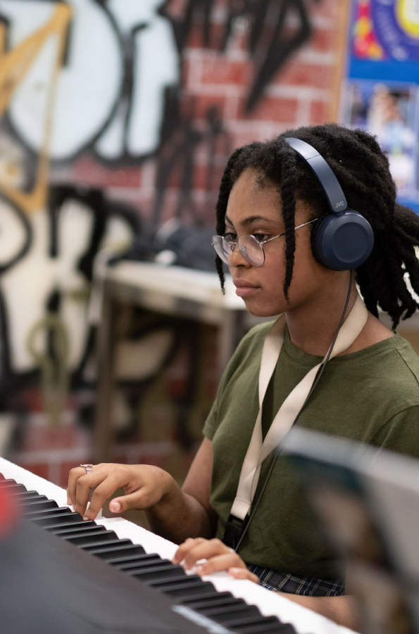 Middle School student playing the piano