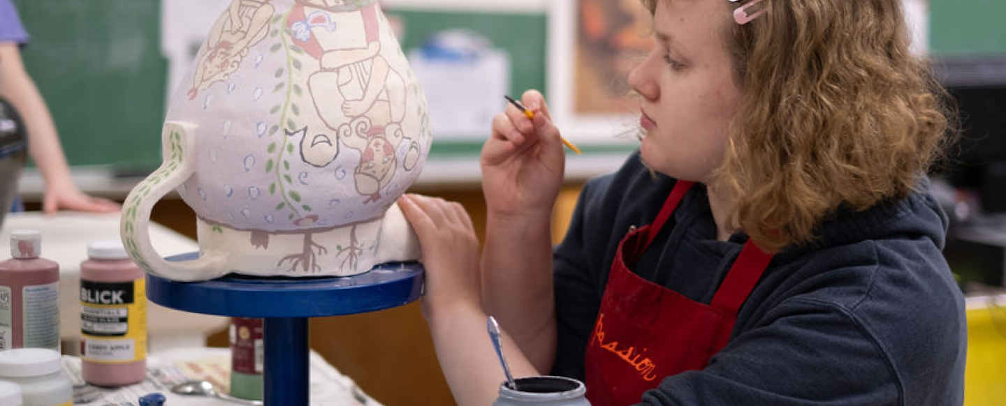 Student painting ceramics