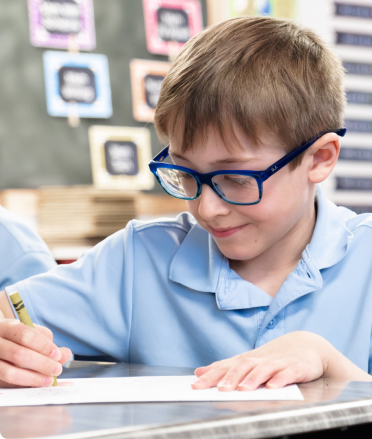 Student smiling while doing work